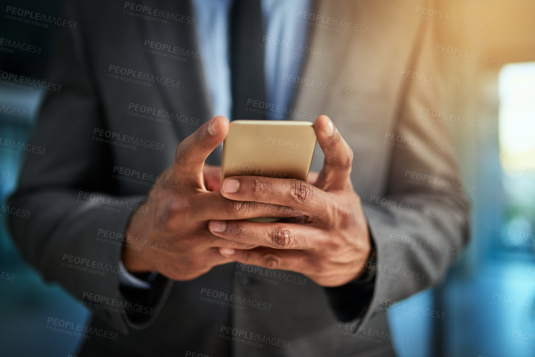 Buy stock photo Business man browsing the internet on his phone texting and posting on social media. Closeup of a male entrepreneur browsing or searching a website or web for news or clickbait