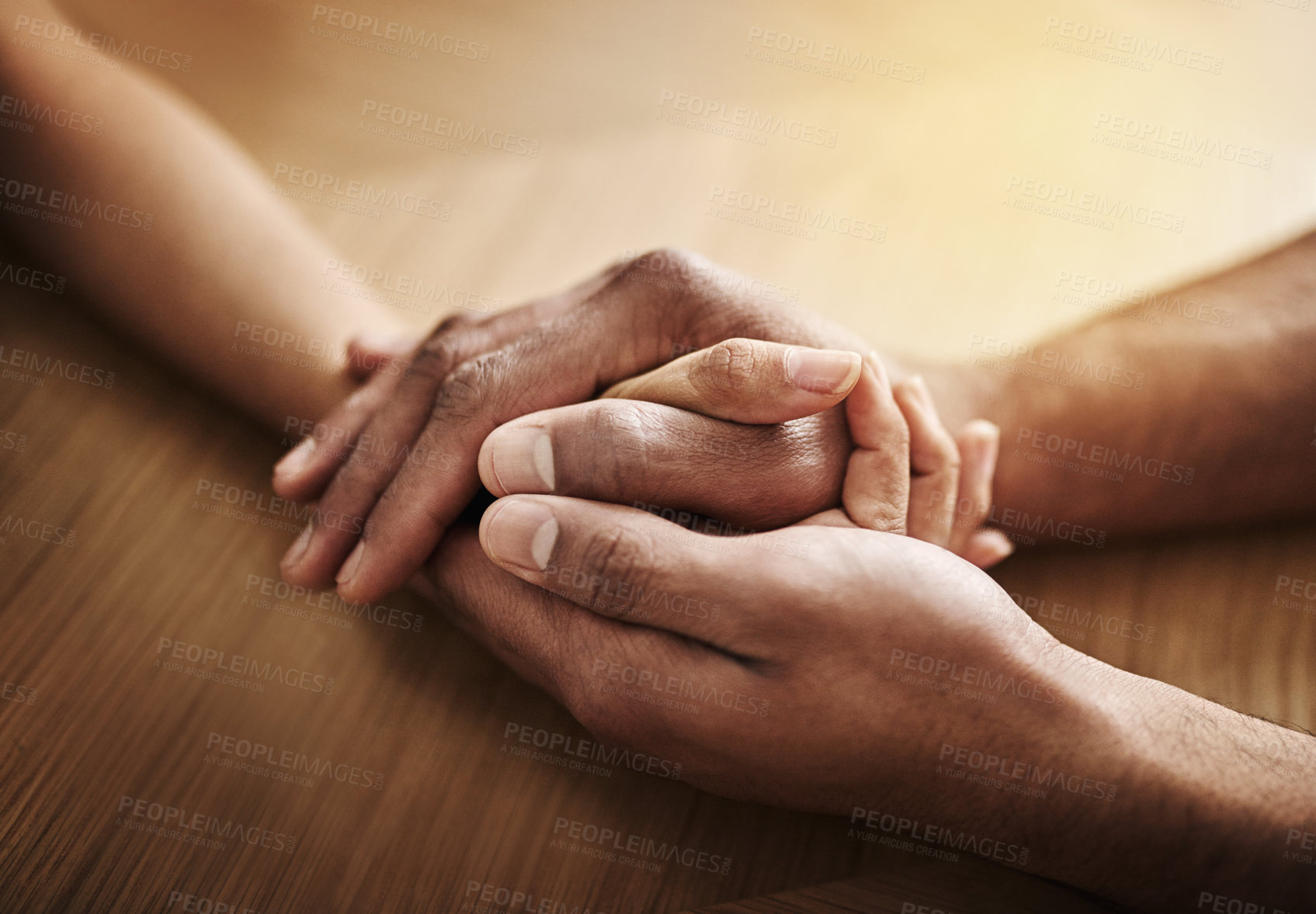 Buy stock photo Holding hands in support and comfort, showing love, care and consoling a friend. Two people together in unity, solidarity and trust, showing kindness, hope and faith while helping and bonding closeup