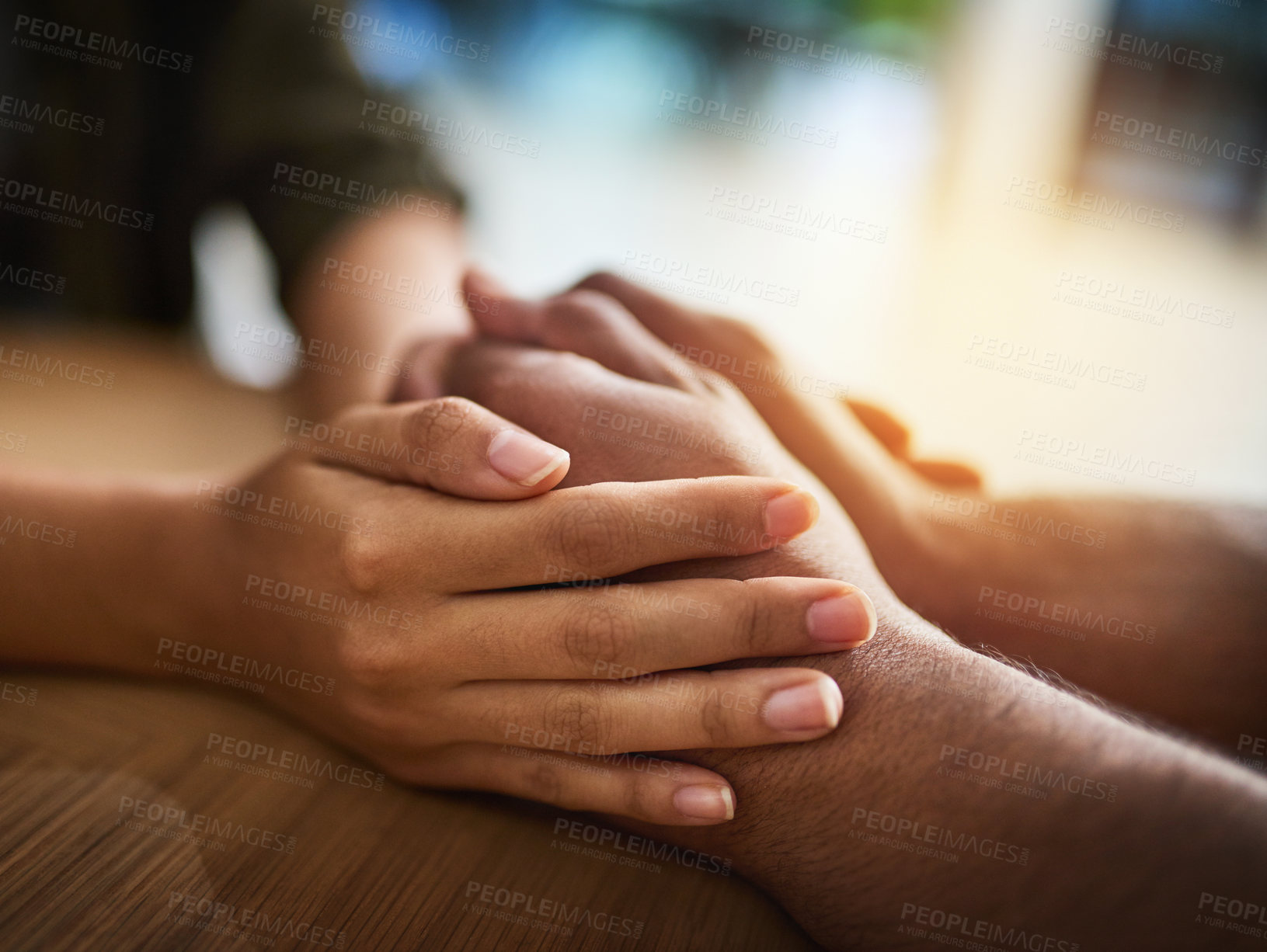 Buy stock photo Holding hands showing care, love and support between friends, couple or family. People comforting, giving affection and consoling with a hand gesture and touch for compassion, empathy and kindness