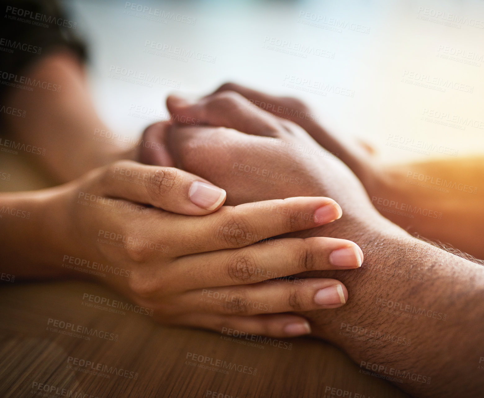 Buy stock photo Holding hands showing care, love and support between friends, couple or family. People comforting, giving affection and consoling with a hand gesture and touch for compassion, empathy and kindness