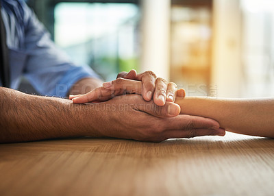Buy stock photo Hands holding together with love, support and care in a touching and bonding moment. Closeup of a close, loving hand hold between two people together. Comforting gesture of sympathy and community