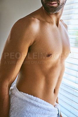 Buy stock photo Shot of an unrecognizable man in a towel at home