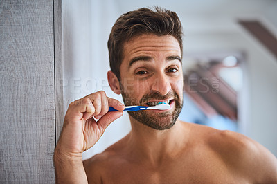 Buy stock photo Portrait, toothbrush and man brushing teeth in bathroom for dental wellness, healthy habit or gum care at home. Face, guy and cleaning mouth for fresh breath, oral hygiene or morning grooming routine