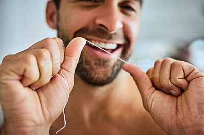 Buy stock photo Hands, face and man floss teeth for smile, dental health and care for gum gingivitis at home. Closeup of happy guy, oral thread and cleaning mouth for fresh breath, tooth hygiene and healthy habit