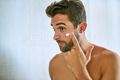 Buy stock photo Man, face and cream for skincare, beauty and sunscreen at home with mockup for morning routine, grooming and self care. Young guy, lotion and facial cosmetics for dermatology, clean skin and hygiene