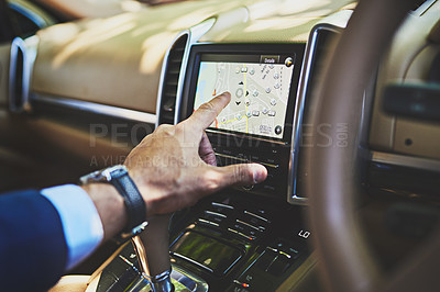 Buy stock photo Shot of a unrecognizable person putting a location on a GPS inside of a car while driving