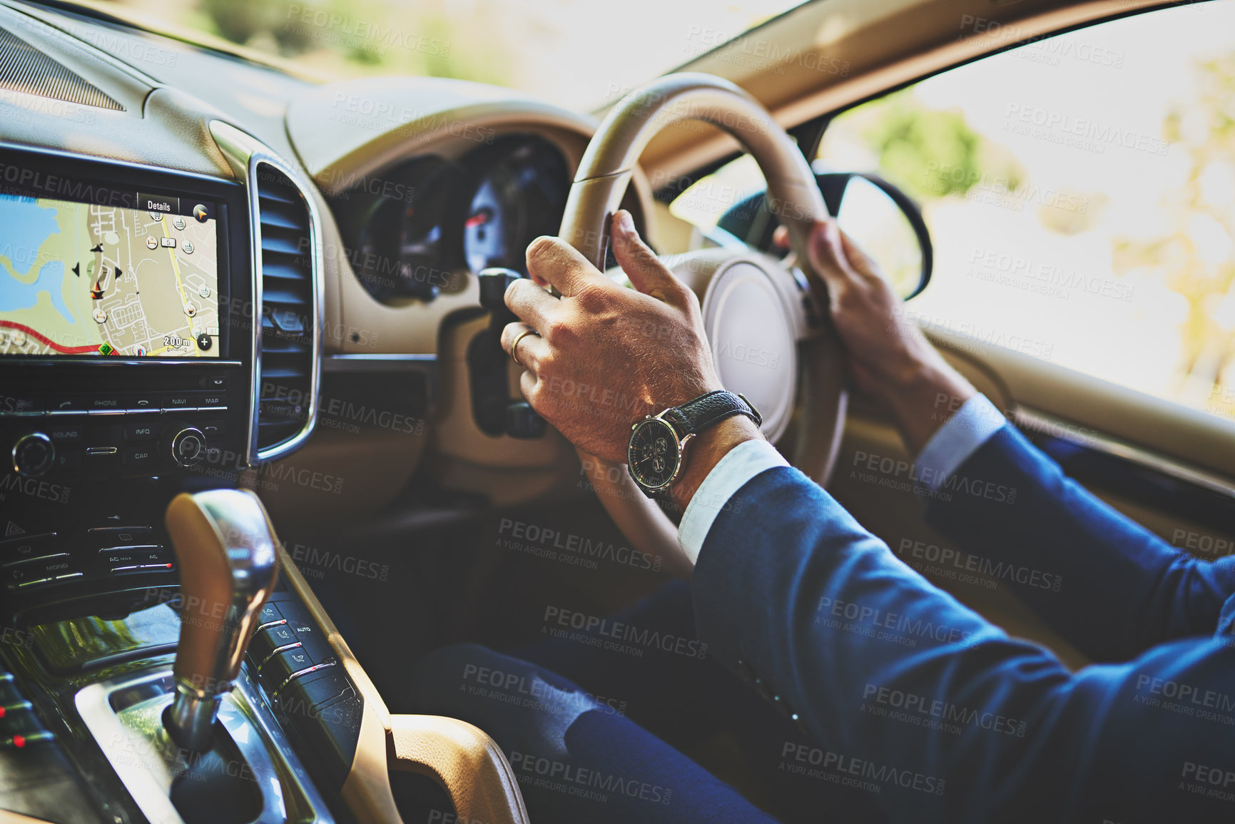 Buy stock photo Shot of a unrecognizable businessman driving in his car on his way to work