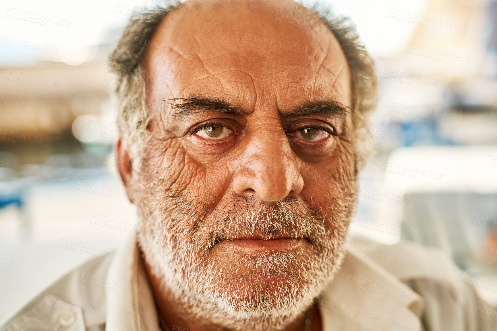 Buy stock photo Portrait of a confident senior man standing outside while looking at the camera