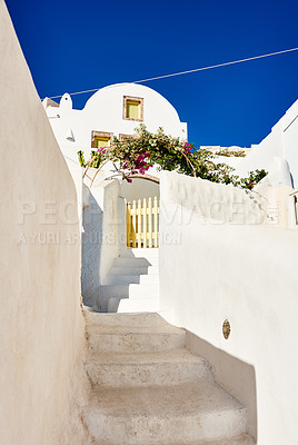 Buy stock photo Shot of a beautiful constructed white building with steps running down the side outside during the day