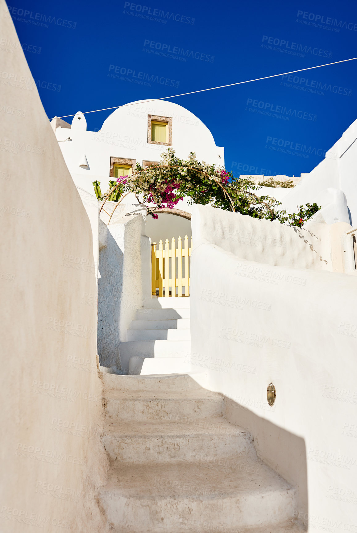 Buy stock photo Shot of a beautiful constructed white building with steps running down the side outside during the day