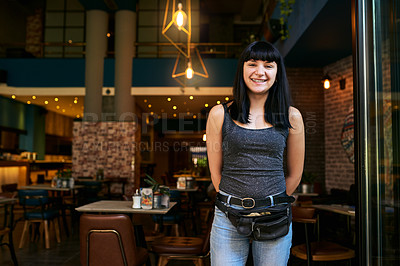 Buy stock photo Shot of a waitress working at a bar
