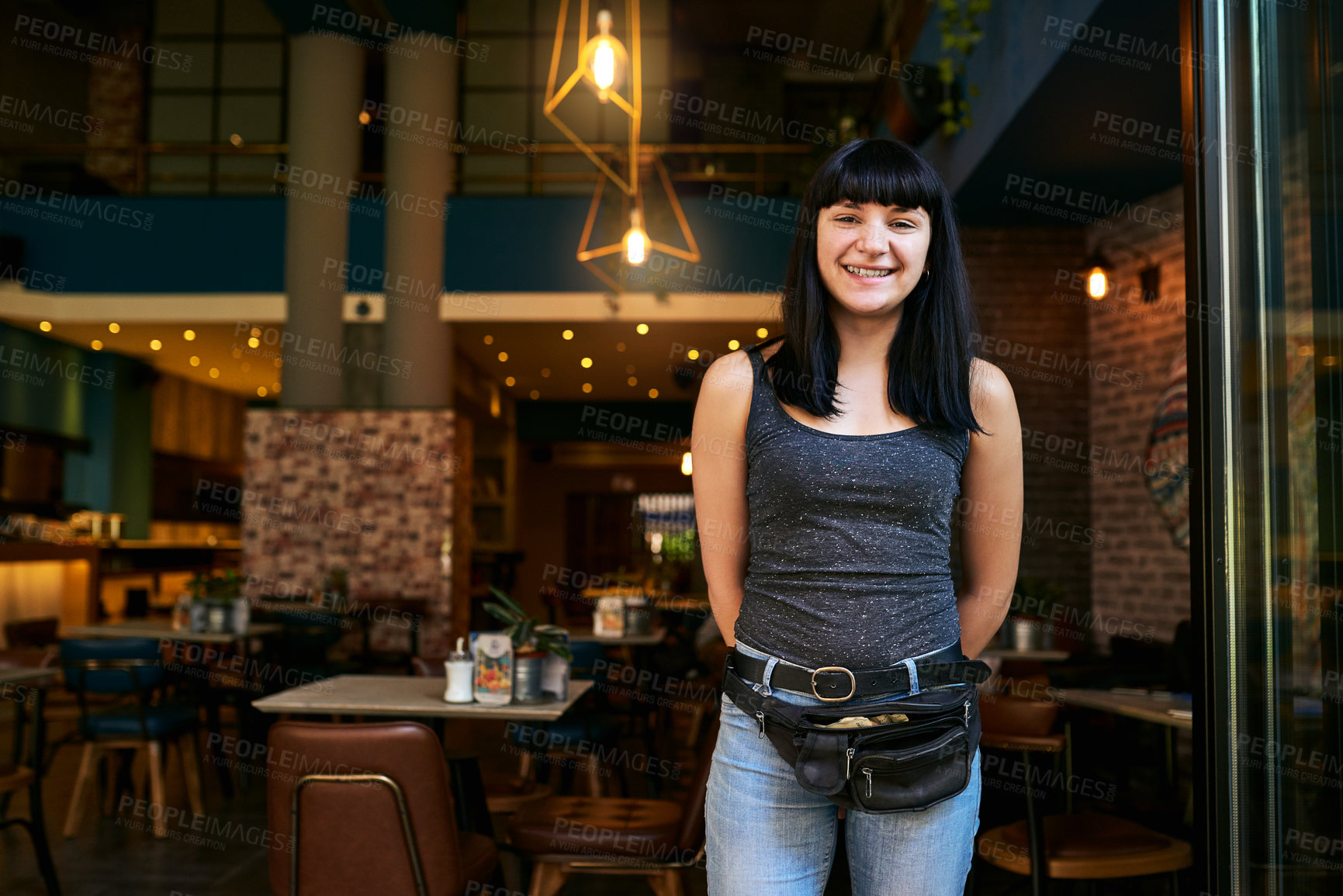 Buy stock photo Shot of a waitress working at a bar