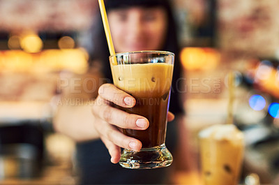 Buy stock photo Shot of a young waitress working behind the counter at a bar