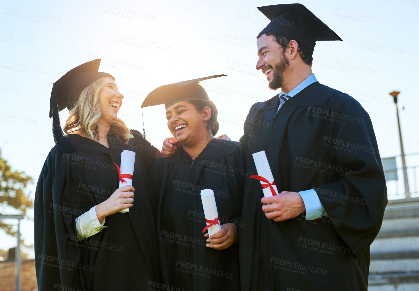 Buy stock photo Graduation, happy and students on campus with award, support and excited for success. Knowledge, qualification and people in university with certificate, higher education and smile for development