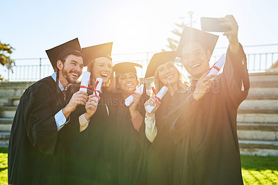 Buy stock photo Education, graduation and selfie of student friends outdoor on campus for celebration or ceremony. Certificate, photograph and smile with happy graduate people at college or university for success