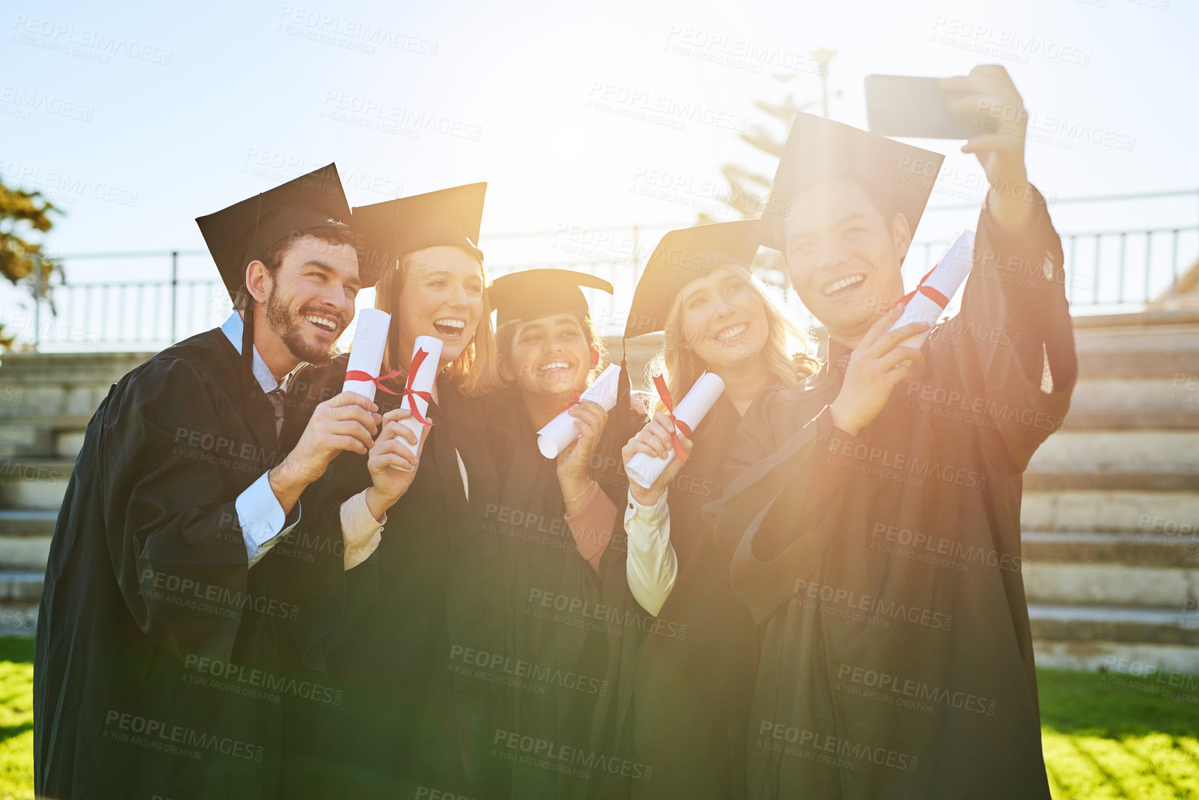 Buy stock photo Education, graduation and selfie of student friends outdoor on campus for celebration or ceremony. Certificate, photograph and smile with happy graduate people at college or university for success