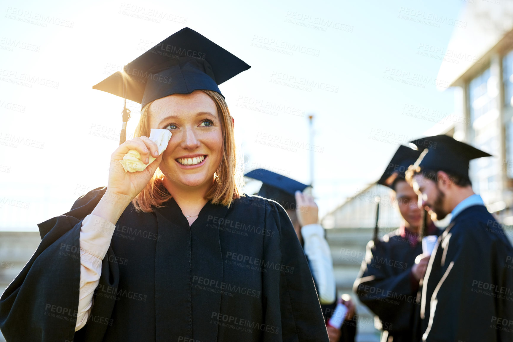 Buy stock photo Education, graduation and tears of student woman outdoor on campus for celebration or ceremony.  Smile, thinking and tissue with graduate person crying at college or university for milestone