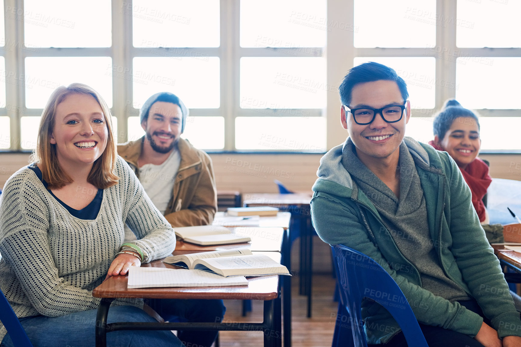 Buy stock photo Cropped portrait of a group of university students sitting in class during a lecture