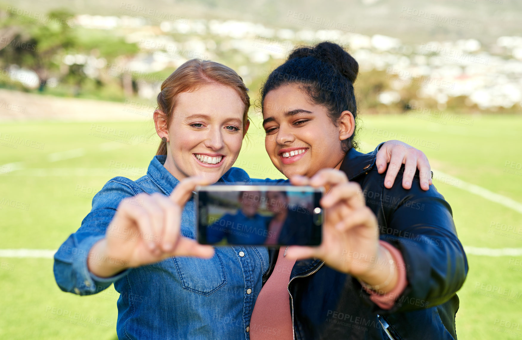 Buy stock photo Shot of female friends taking a picture together outside