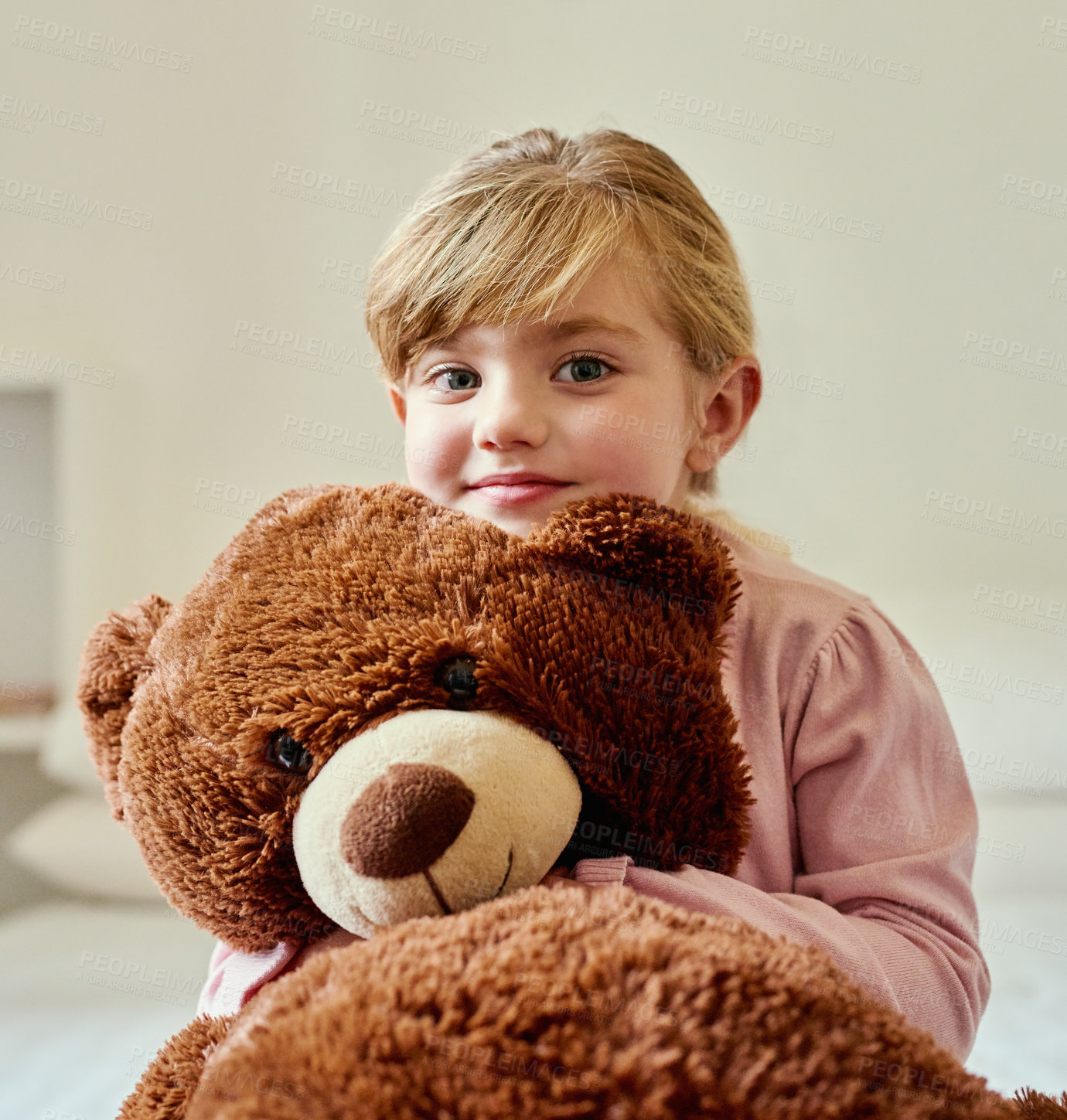 Buy stock photo Portrait of a little girl holding her teddy bear at home
