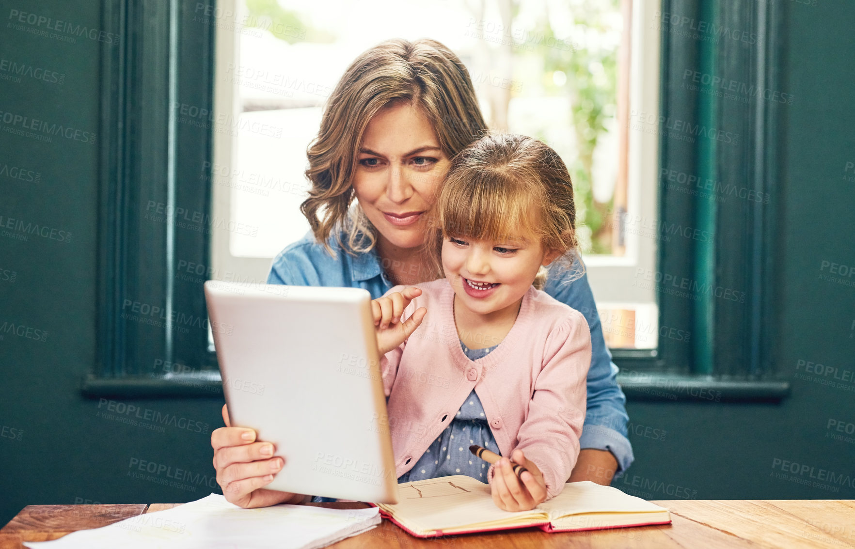 Buy stock photo Education, notebook or tablet and mother with daughter in dining room of apartment for distance learning. Homeschool smile and parent teaching girl kid for child development, future or growth