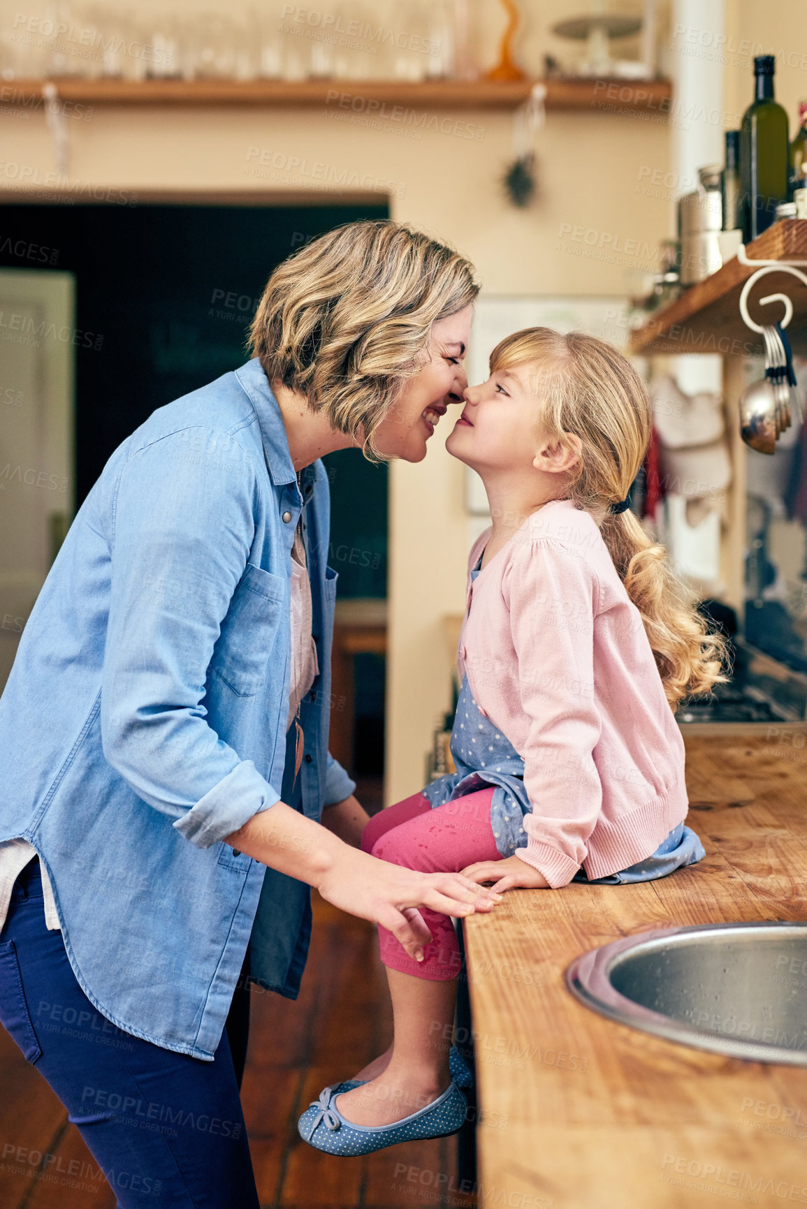 Buy stock photo Happy, woman and child playing nose at house for love, bonding and relationship with care on mothers day. Smile, mother and girl embrace together for support, trust and security on kitchen counter