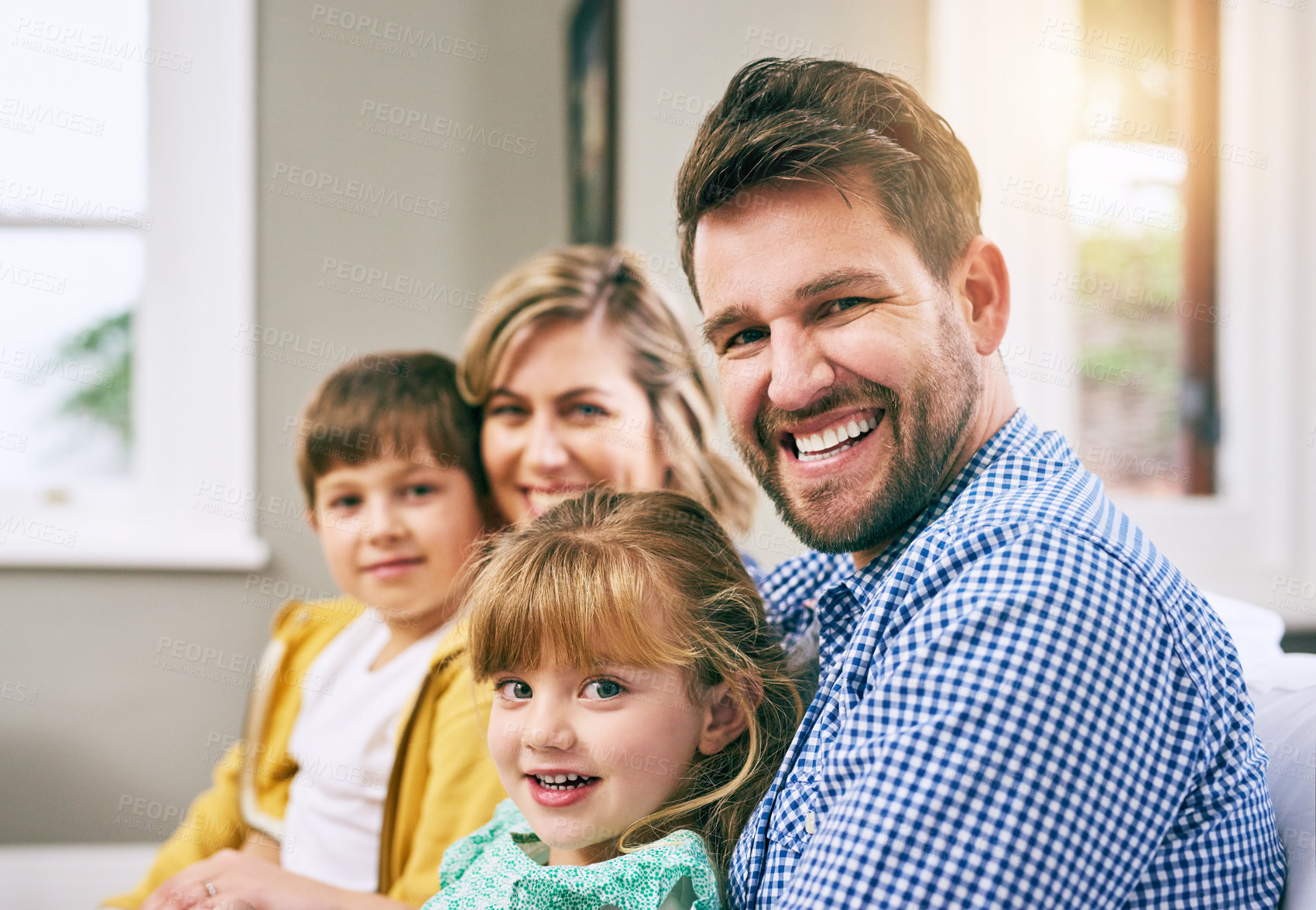 Buy stock photo Family, portrait and happy in house for relax, bonding and support with parents, love and care. Mom, dad and children in living room for comfort, relationship and embrace together on weekend on sofa