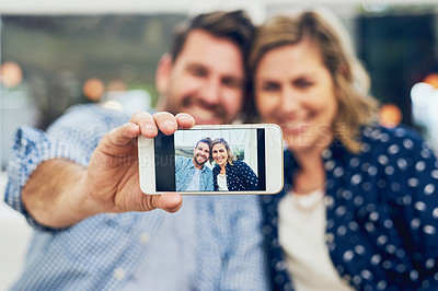 Buy stock photo Happy couple, phone and camera with selfie on sofa for photography, picture or memory at home. Young man, woman or lovers with smile, mobile smartphone display or screen for bonding moment at house