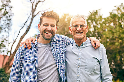 Buy stock photo Shot of a senior father and his adult son bonding outside