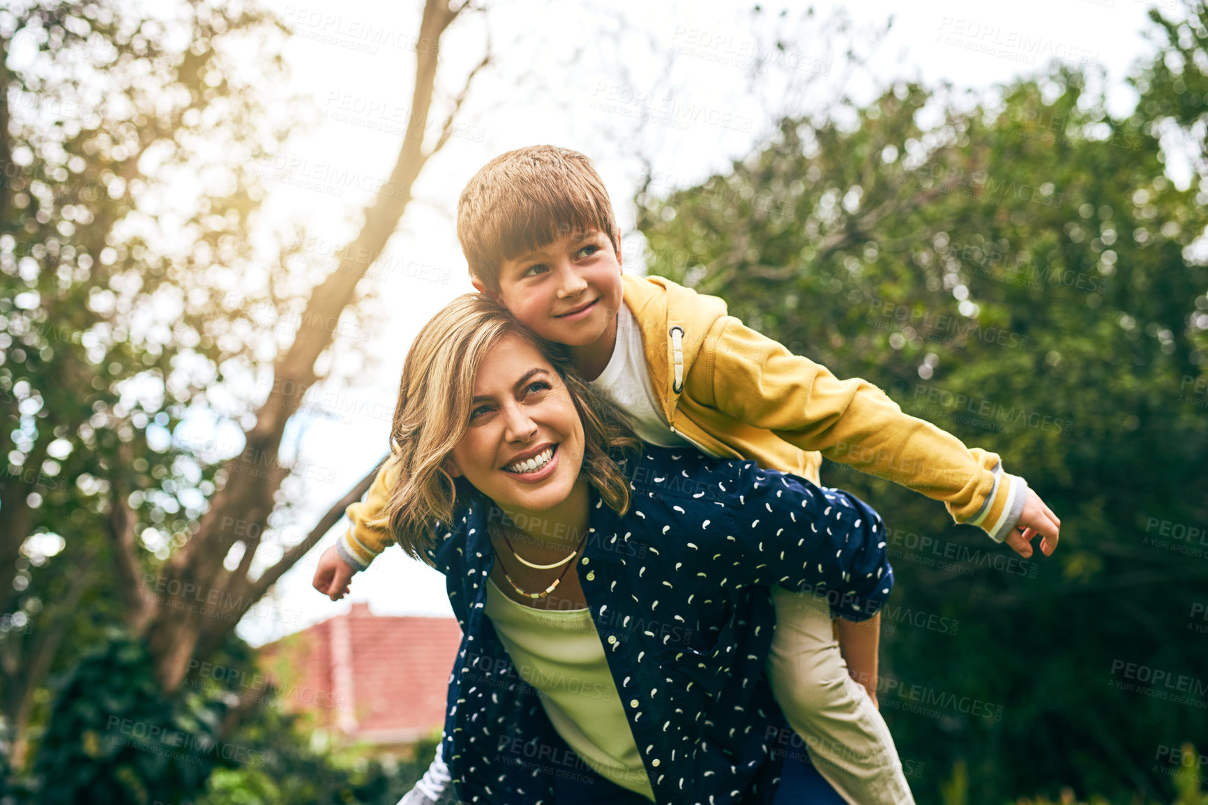 Buy stock photo Shot of a mother bonding with her son outside
