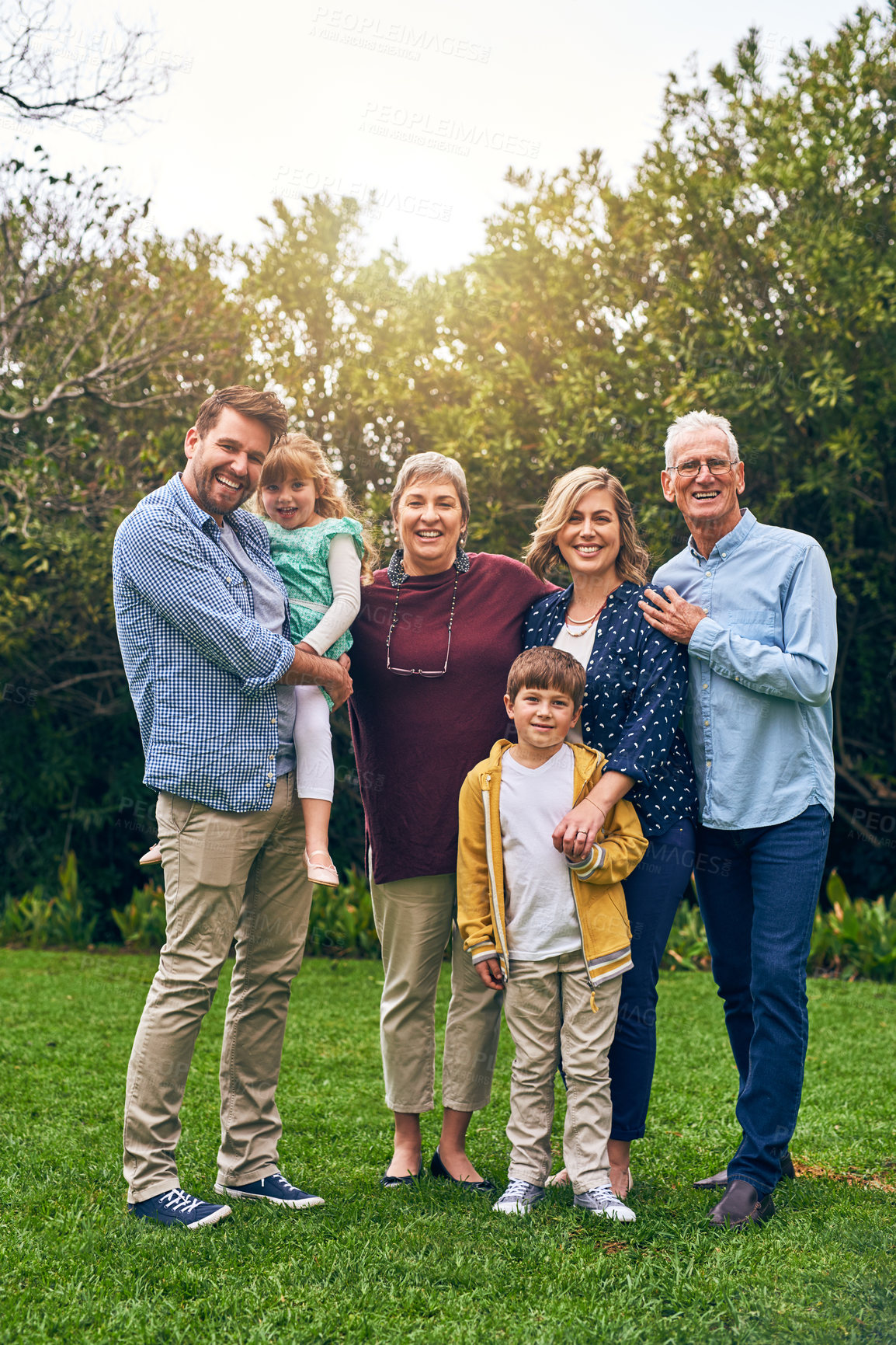 Buy stock photo Family, generations and outdoor portrait on trip, vacation and support in relationship connection. Grandparents, parents and together for security embrace in countryside, love and travel to England