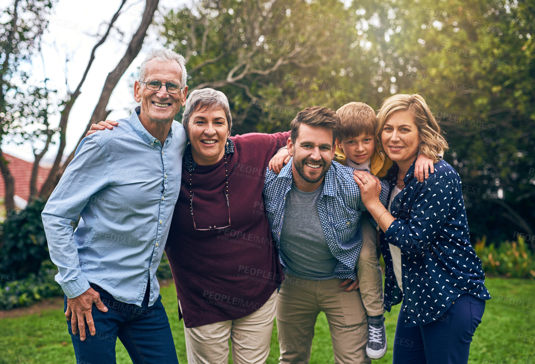 Buy stock photo Big family, generations and outdoor portrait on vacation, love and support in relationship connection. Grandparents, parents and kid for security embrace in countryside, love and travel to England