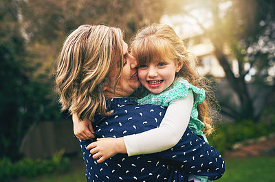 Buy stock photo Shot of a mother and her daughter bonding outside