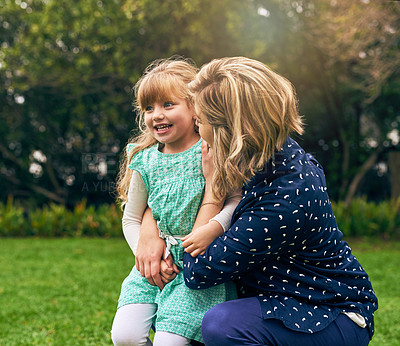 Buy stock photo Mother, girl and happy on hug at park for fun, bonding and care on break for child development or growth in France. Parent, kid and smile in garden with playing on lawn, relax and chill for support