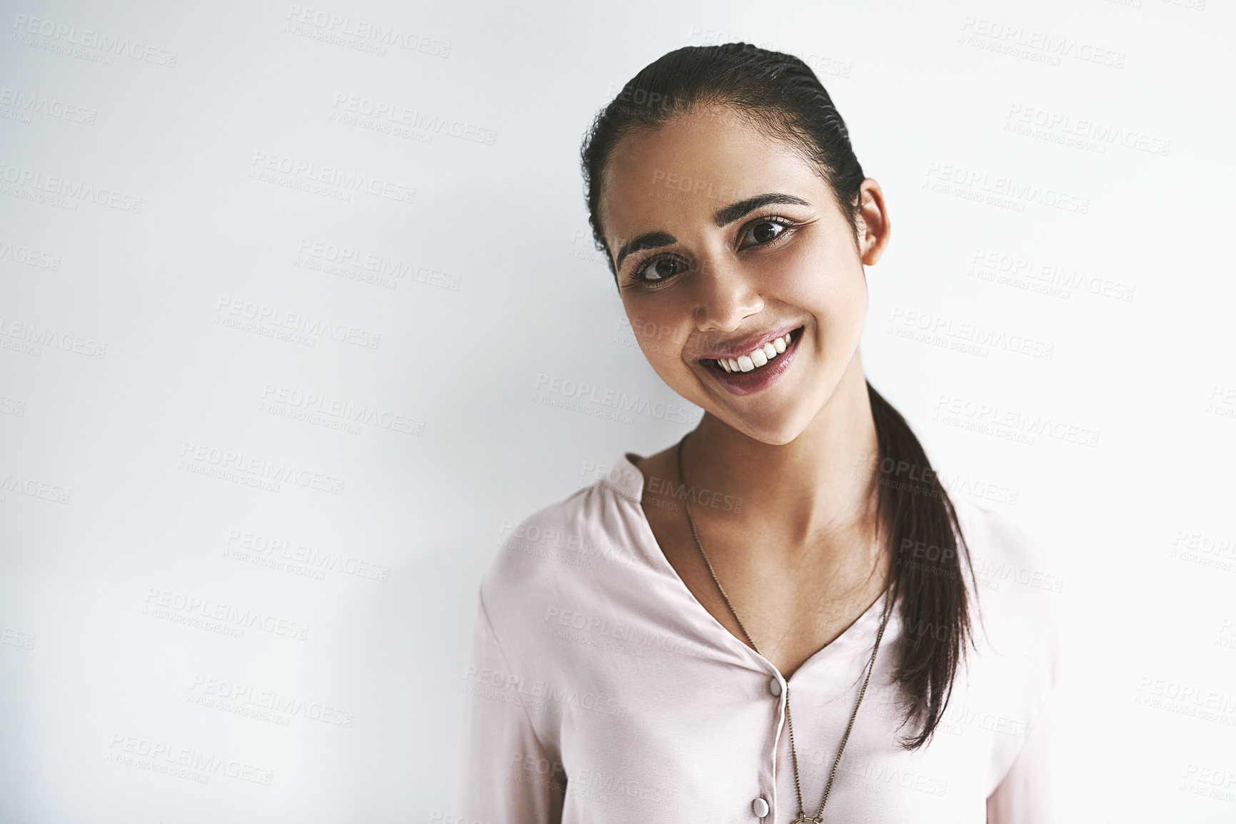 Buy stock photo Portrait of a young businesswoman standing against a white background