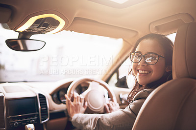 Buy stock photo Portrait of a young businesswoman driving a car