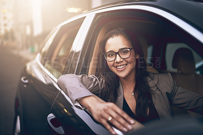Buy stock photo Portrait of a young businesswoman driving a car