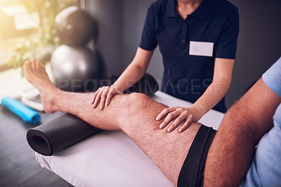 Buy stock photo Leg, hands and physical therapy on bed for healing, rehabilitation and recovery from pain. Male patient, physiotherapist and knee injury in fitness center for healthcare, massage and consultation