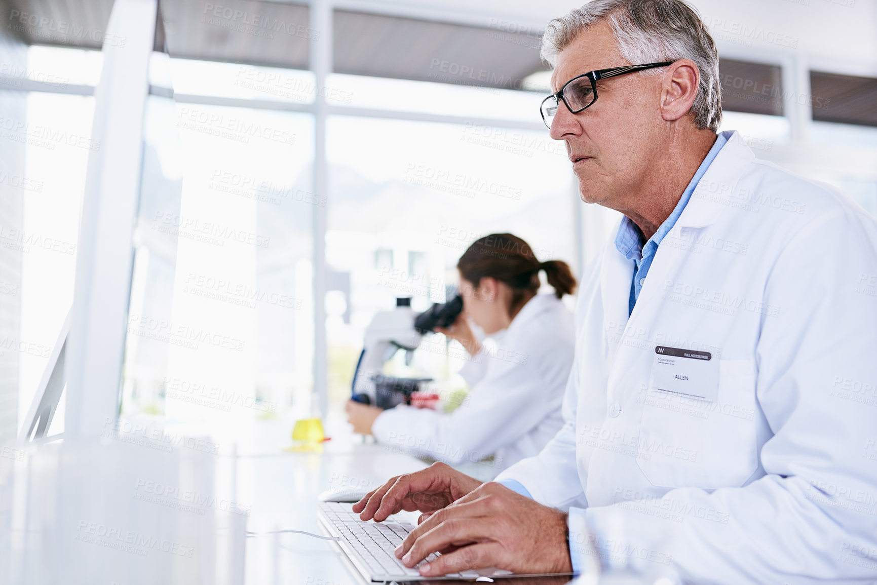 Buy stock photo Scientist, man and computer in science research, experiment or data results at laboratory. Senior male typing in medical healthcare working on pc or technology in forensic or scientific lab for cure