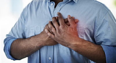 Buy stock photo Closeup shot of an unidentifiable businessman suffering with chest pain at work