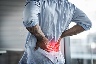 Buy stock photo Closeup shot of an unidentifiable businessman suffering with back pain at work