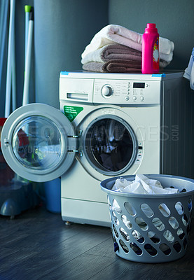 Buy stock photo Washing machine, laundry or detergent in home for cleaning, housekeeping or weekend chores. Towel stack, fabric softener or front loader in apartment for hygiene, maintenance or appliance with basket