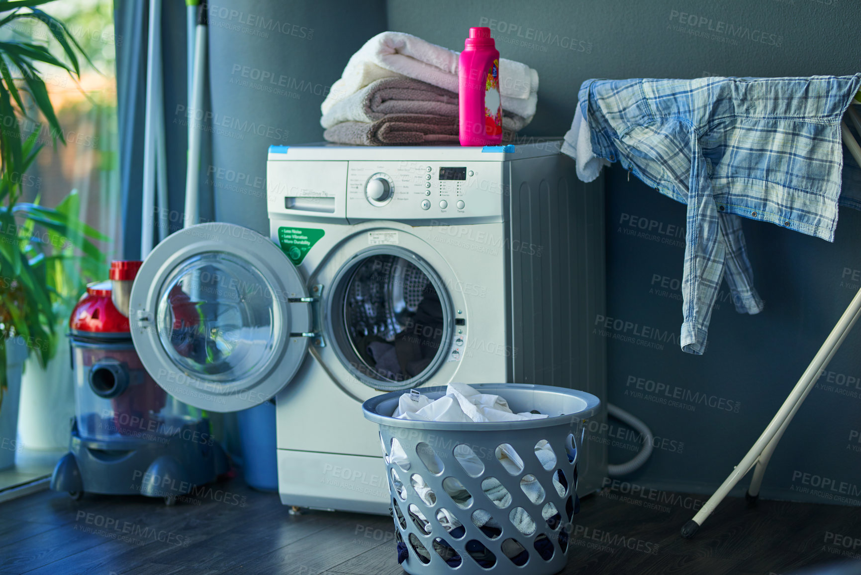 Buy stock photo Shot of a washing machine at home