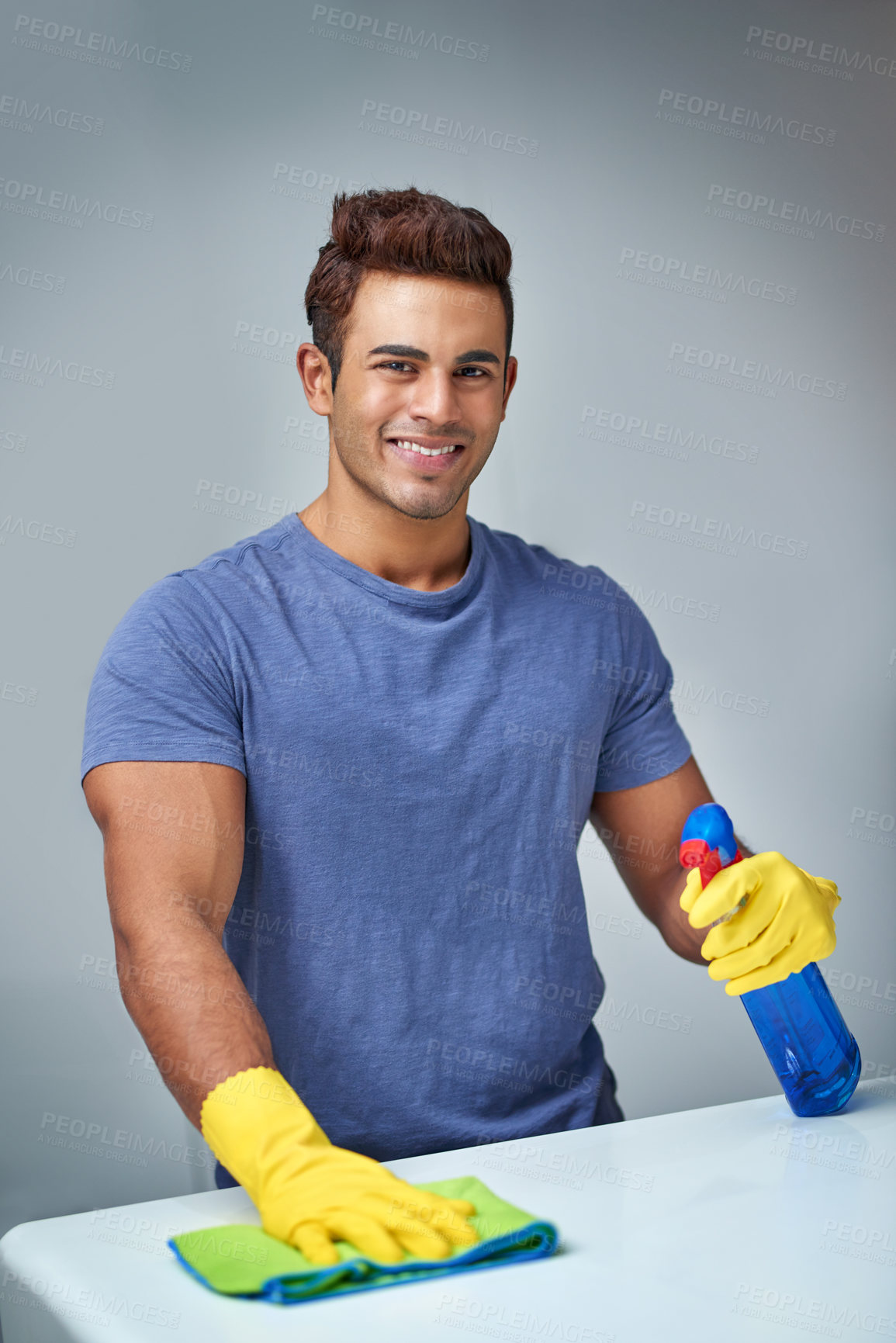 Buy stock photo Portrait, chemical and man with chores, cleaning and proud of disinfectant, product and polishing. Home, cloth and maintenance for hygiene, happy and person with gloves, bacteria and sanitation