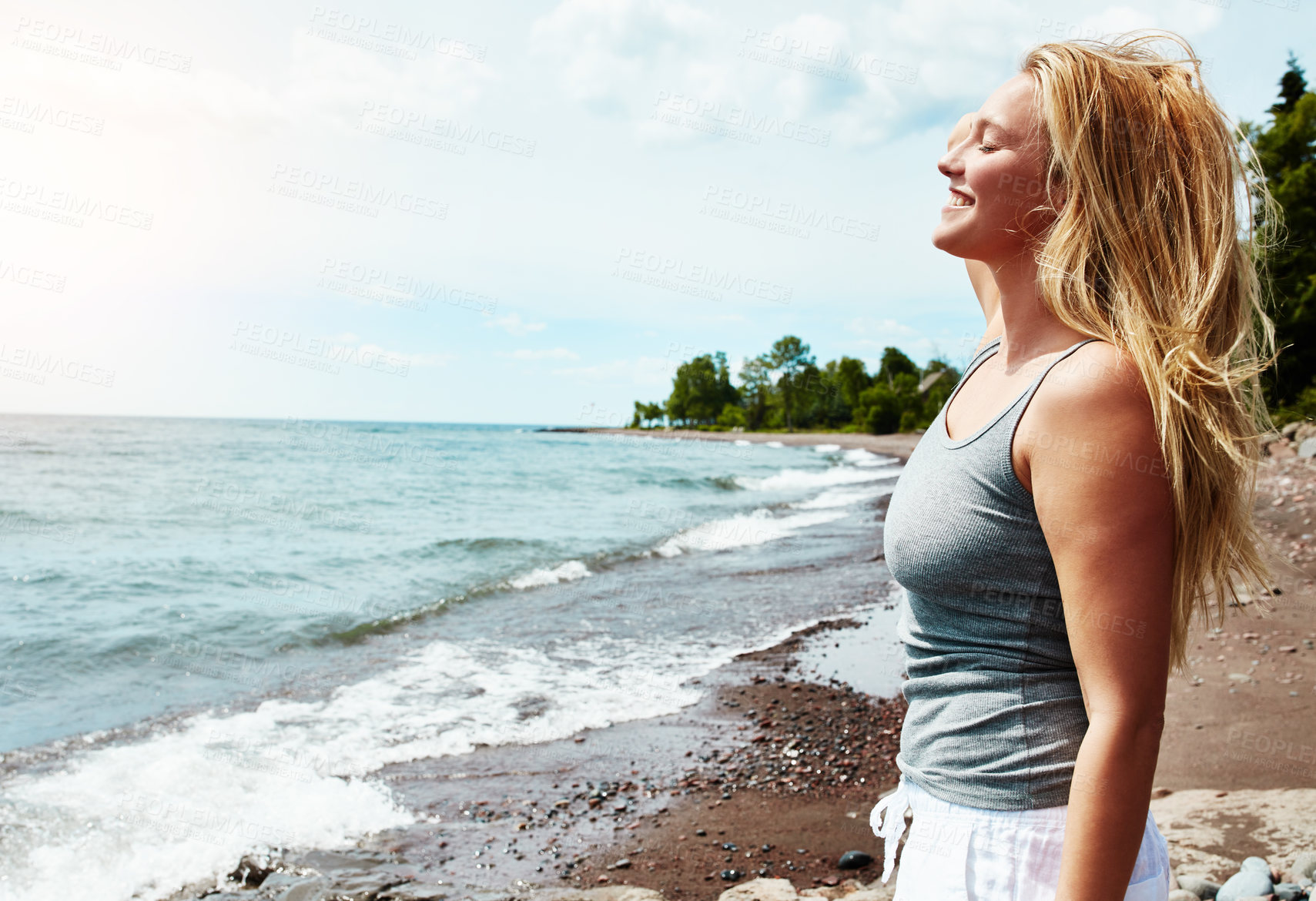 Buy stock photo Young woman, relax and smile for beach vacation, summer freedom or adventure travel in nature. Female person,  outdoor space and happy for holiday in New Zealand, profile or breathing in fresh air