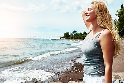 Buy stock photo Young woman, relax and smile for ocean holiday, summer freedom or adventure travel in nature. Female person,  beach and sunshine with happiness for vacation in New Zealand, outdoor for wellness