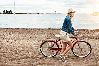Buy stock photo Woman, bike and travel with smile outdoor for vacation, transport and weekend health. Happy, female person and tourist with cycling, holiday or activity with bicycle for wellness, adventure or break