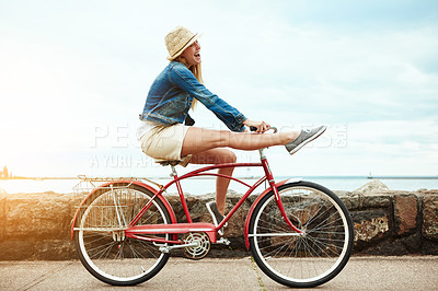 Buy stock photo Vacation, outdoor or woman with bike trick, balance development or active hobby for weekend break. Laughing, fun activity or happy person with stunt execution on sidewalk, skill practice or holiday