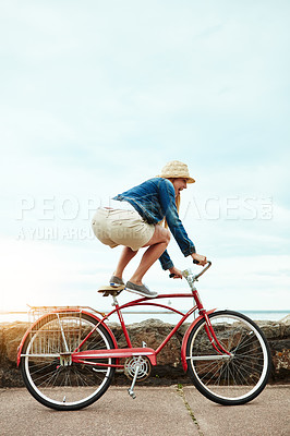 Buy stock photo Holiday, outdoor or woman with bike trick, balance development or active hobby for weekend break. Mockup space, fun activity or person with stunt execution on sidewalk, skill practice or vacation