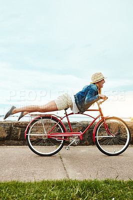 Buy stock photo Holiday, outdoor or woman with bicycle trick, balance development or active hobby for weekend break. Mockup space, fun activity or person with stunt execution on sidewalk, skill practice or vacation